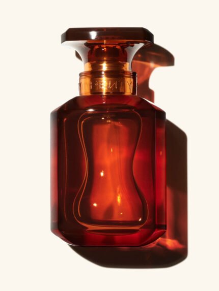 75ml Bottle of Fenty Eau de Parfumon a cream colored background.