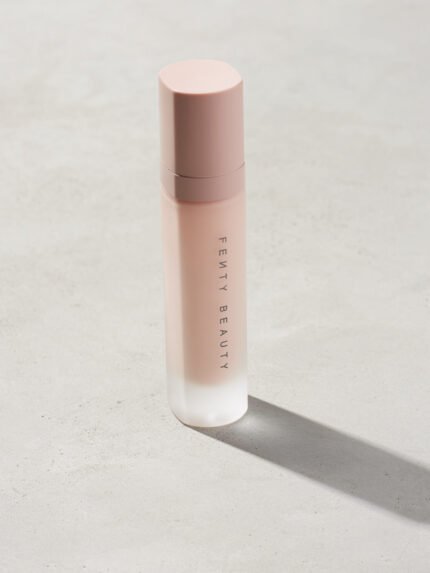Fenty pro filter instant retouch primer standing on a gray background