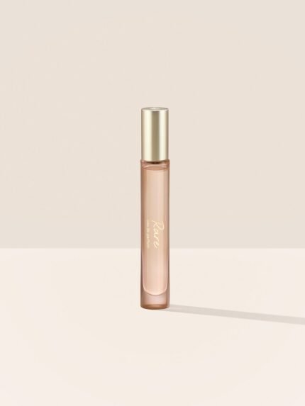 The Rare Eau de Parfum Travel Spray features a tubular bottle with a gold cap and script writing.