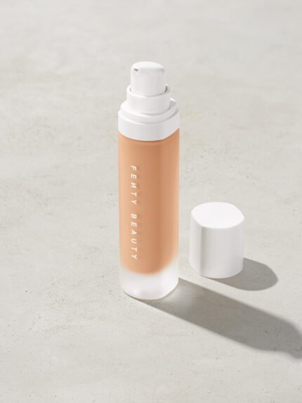 open bottle of Fenty Beauty Pro Filt'r Soft Matte Longwear Foundation with pump dispenser in shade #260 on concrete background