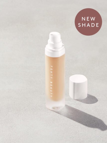 open bottle of Fenty Beauty Pro Filt'r Soft Matte Longwear Foundation with pump dispenser in shade #175 on concrete background
