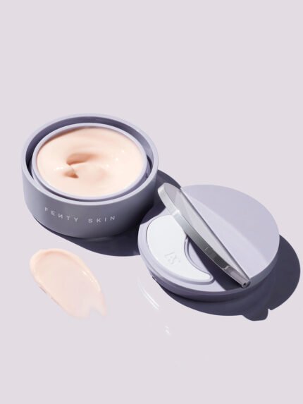 Instant Reset Gel container opened next to its lid, showing the applicator, on a lilac background.