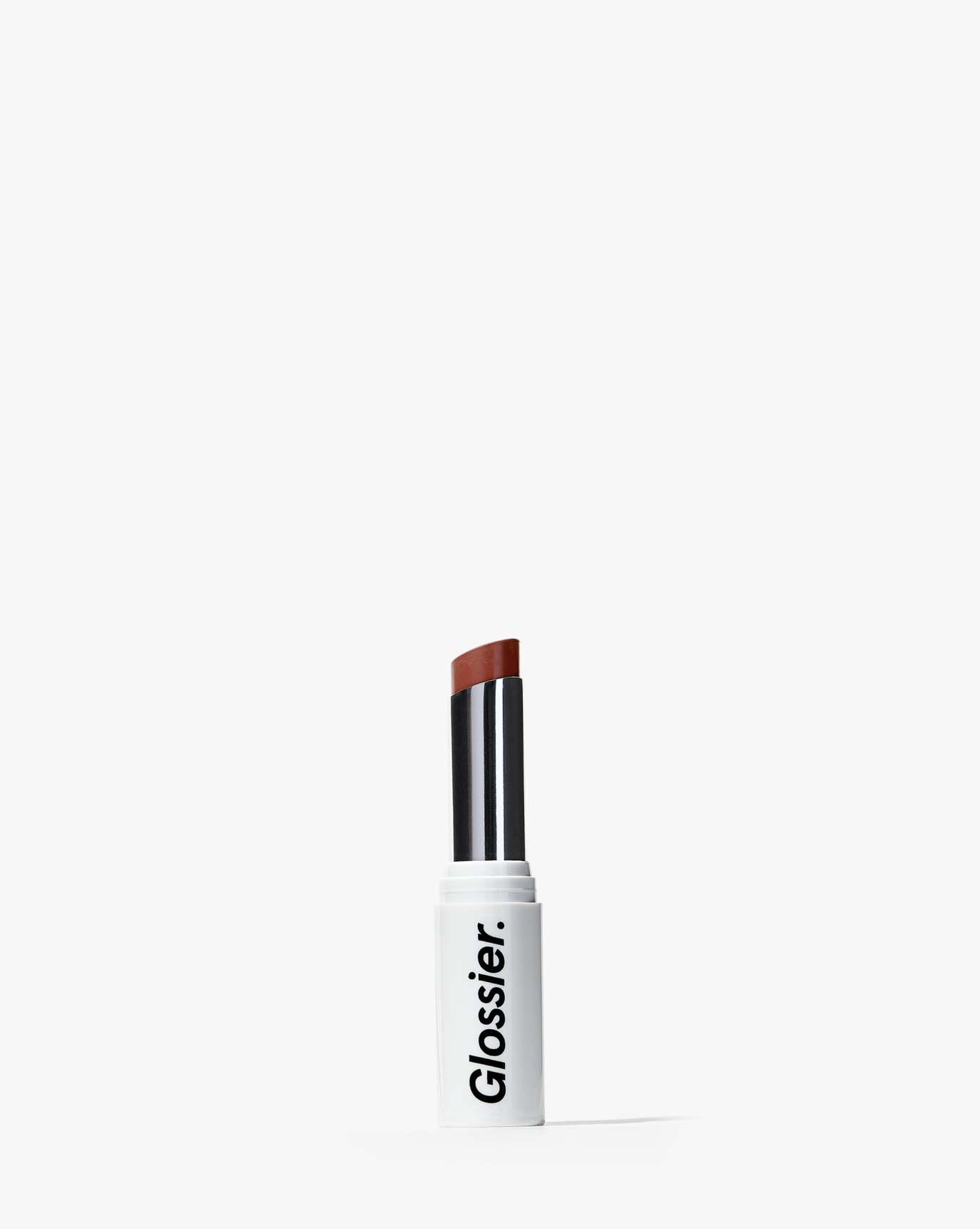 glossier-makeup-geng-cake-carousel-01 cake | image of open tube of generation g lipstick in cake